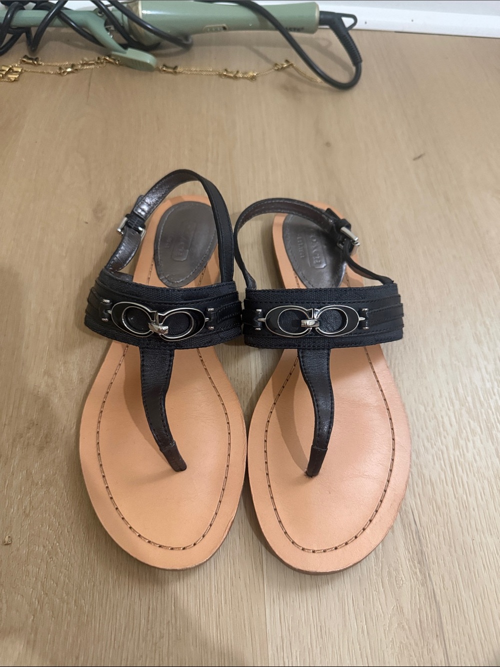 Black Leather T-Strap Sandals with Signature Chain Detail